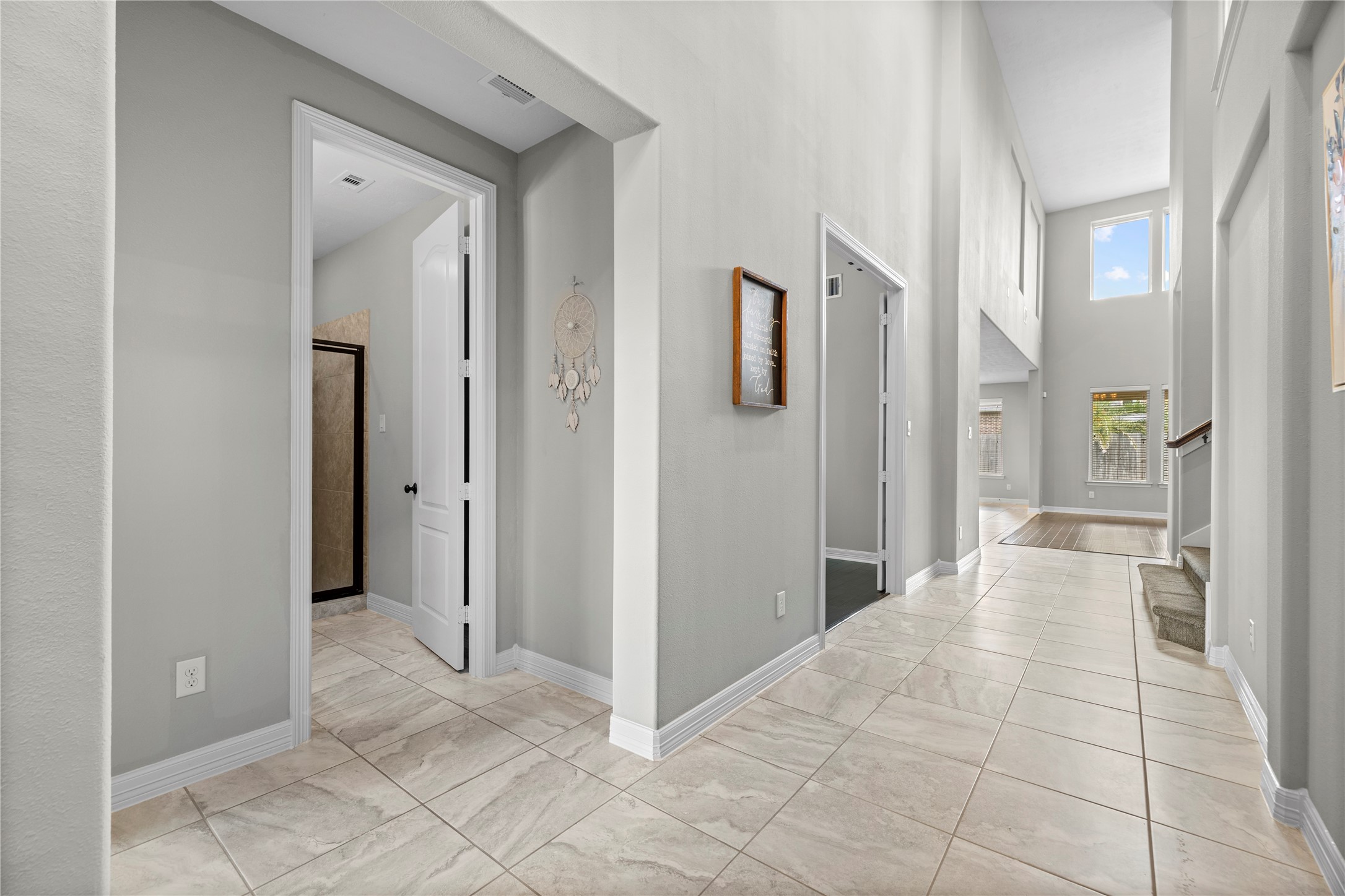 27506 Windcrest Key Lane Fulshear, TX 77441 - Photo 5 of 30 a view of a bathroom with a shower and a sink