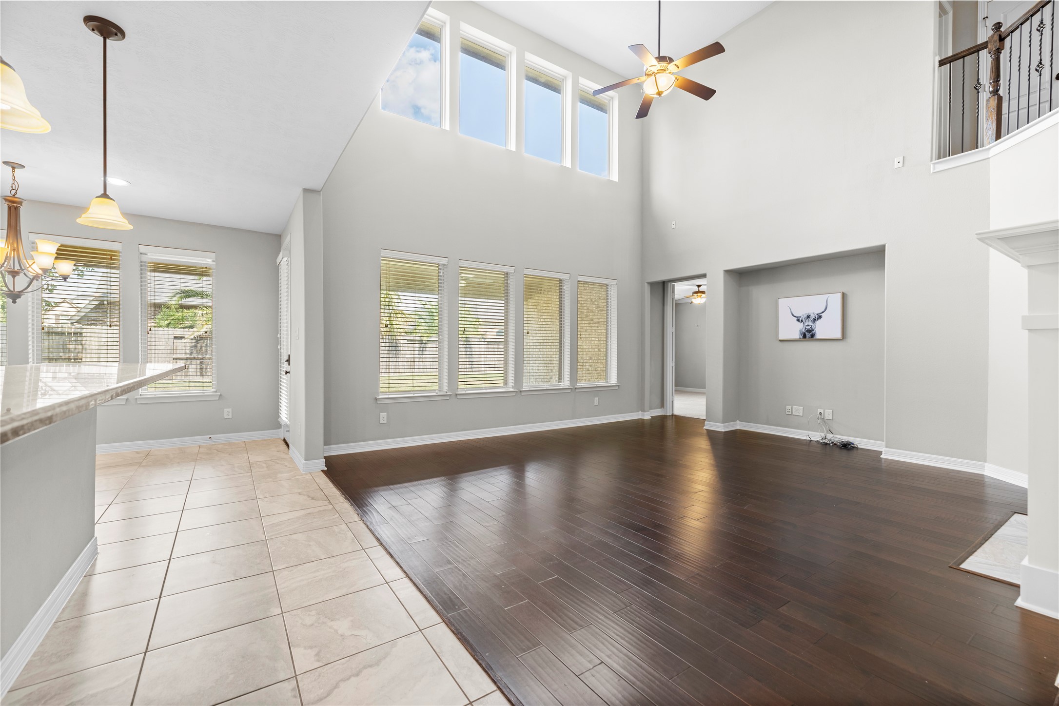 27506 Windcrest Key Lane Fulshear, TX 77441 - Photo 6 of 30 a view of an empty room with window and wooden floor