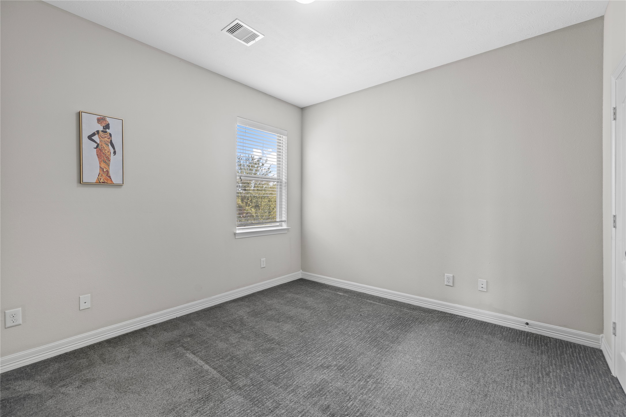 27506 Windcrest Key Lane Fulshear, TX 77441 - Photo 10 of 30 an empty room with windows