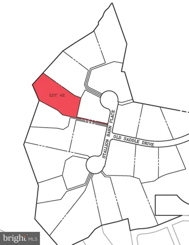 a room with cabinetry and a white wall