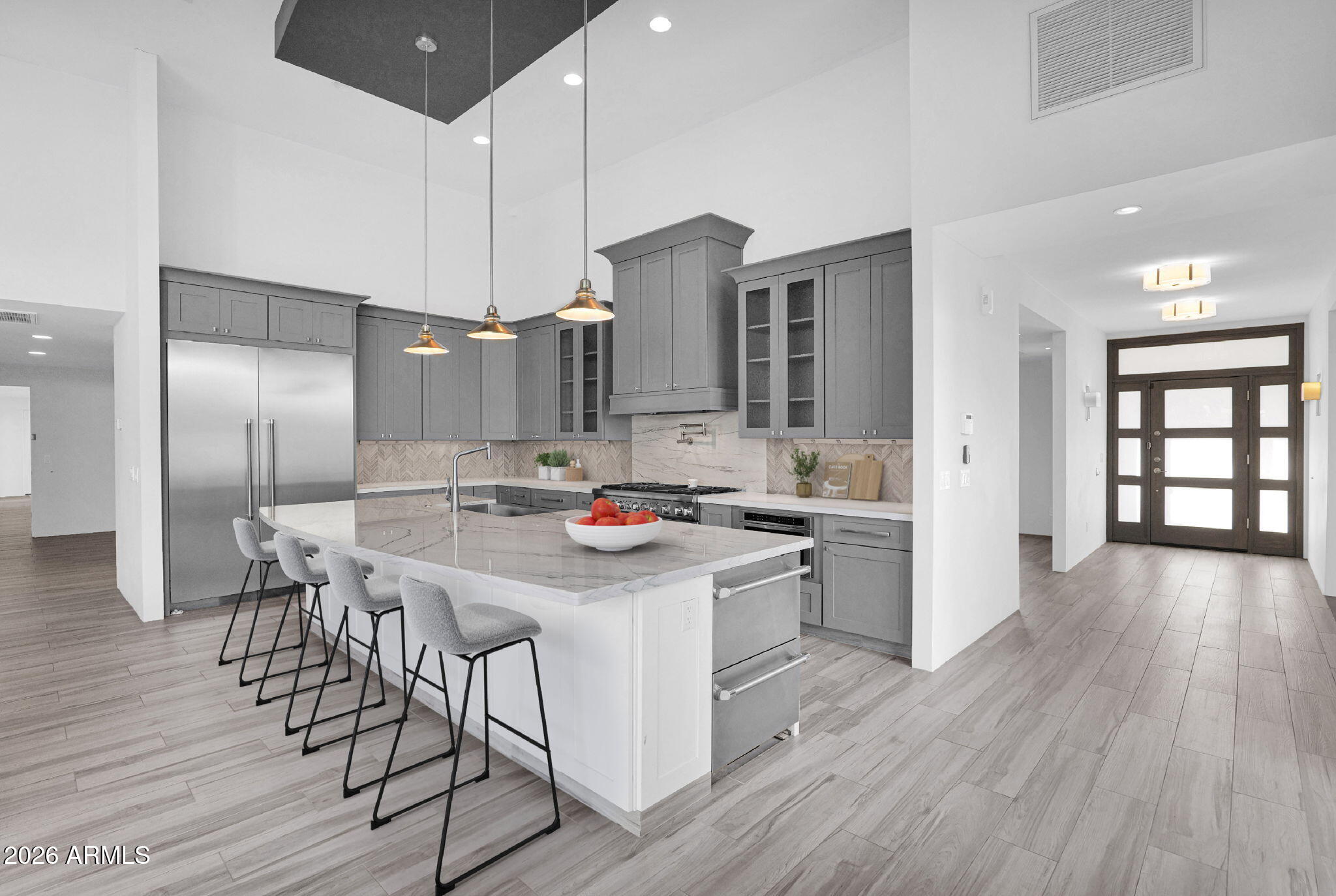 11813 North Blackheath Road Scottsdale, AZ 85254 - Photo 12 of 55 a kitchen with stainless steel appliances a kitchen island hardwood floor and a sink