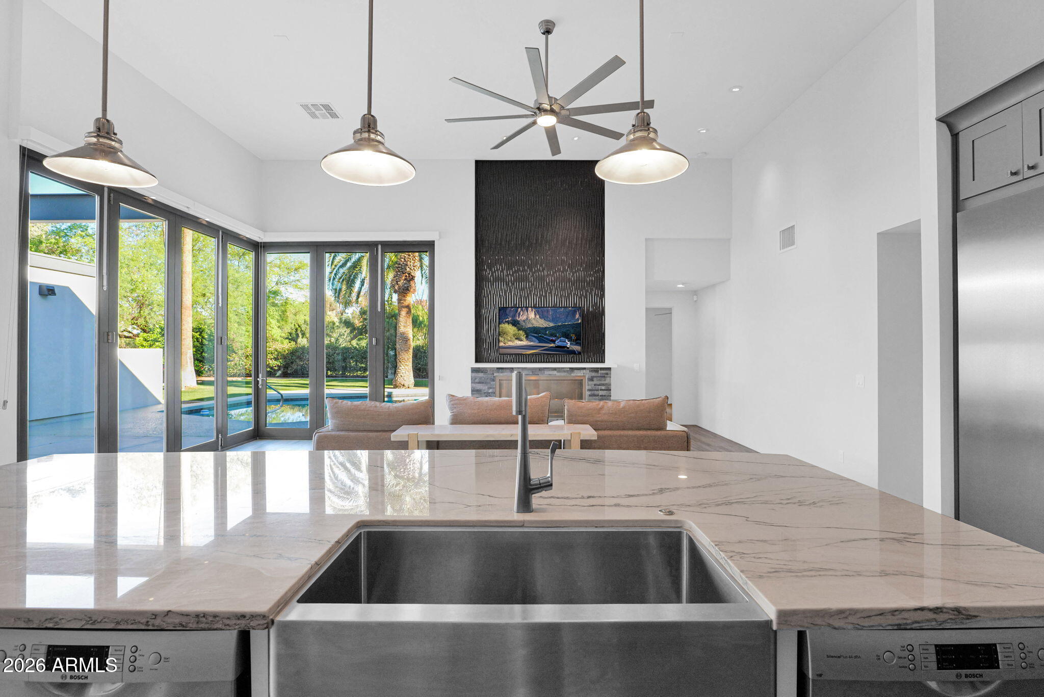 11813 North Blackheath Road Scottsdale, AZ 85254 - Photo 16 of 55 a kitchen with a table and chandelier