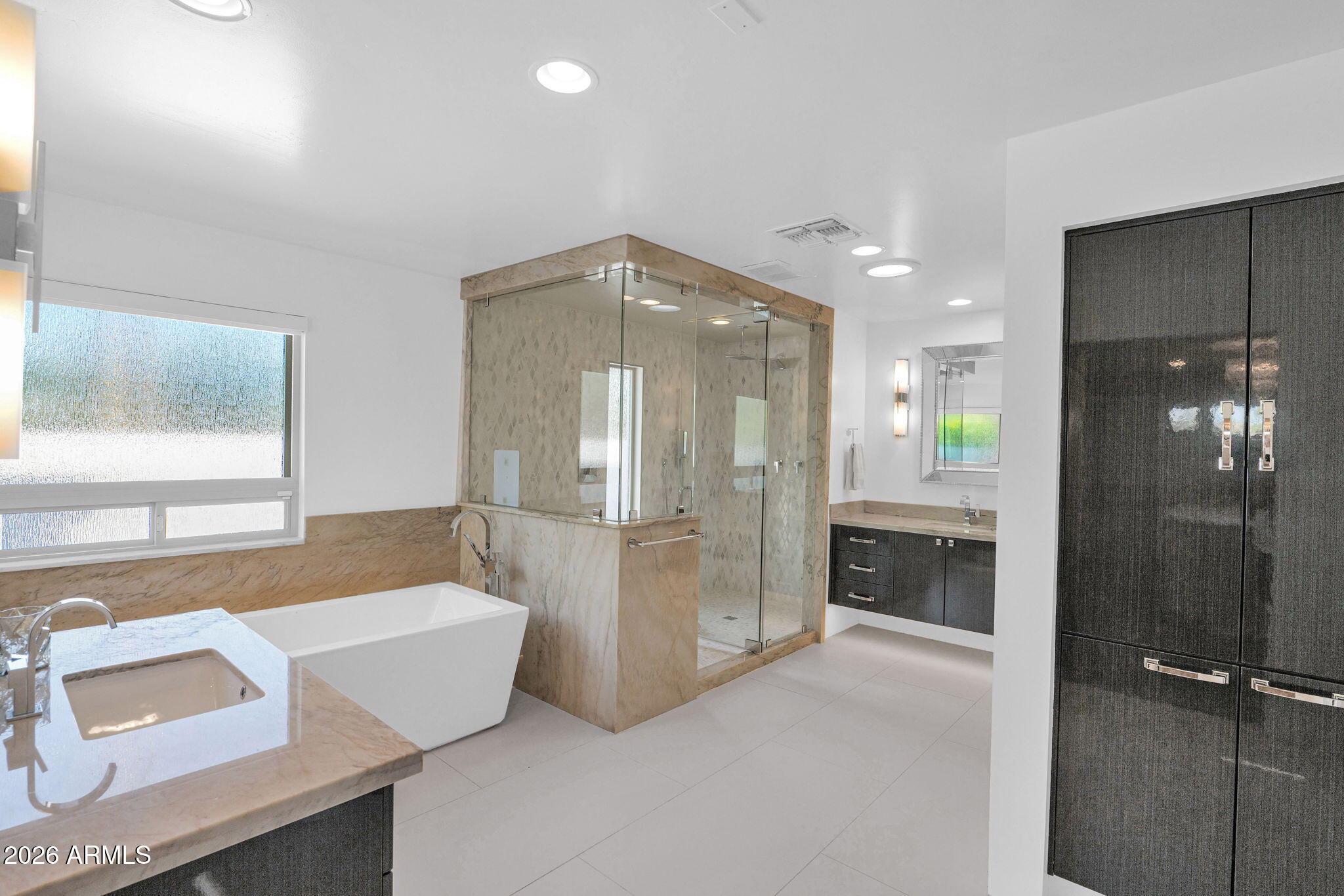 11813 North Blackheath Road Scottsdale, AZ 85254 - Photo 24 of 55 a bathroom with a tub shower and sink
