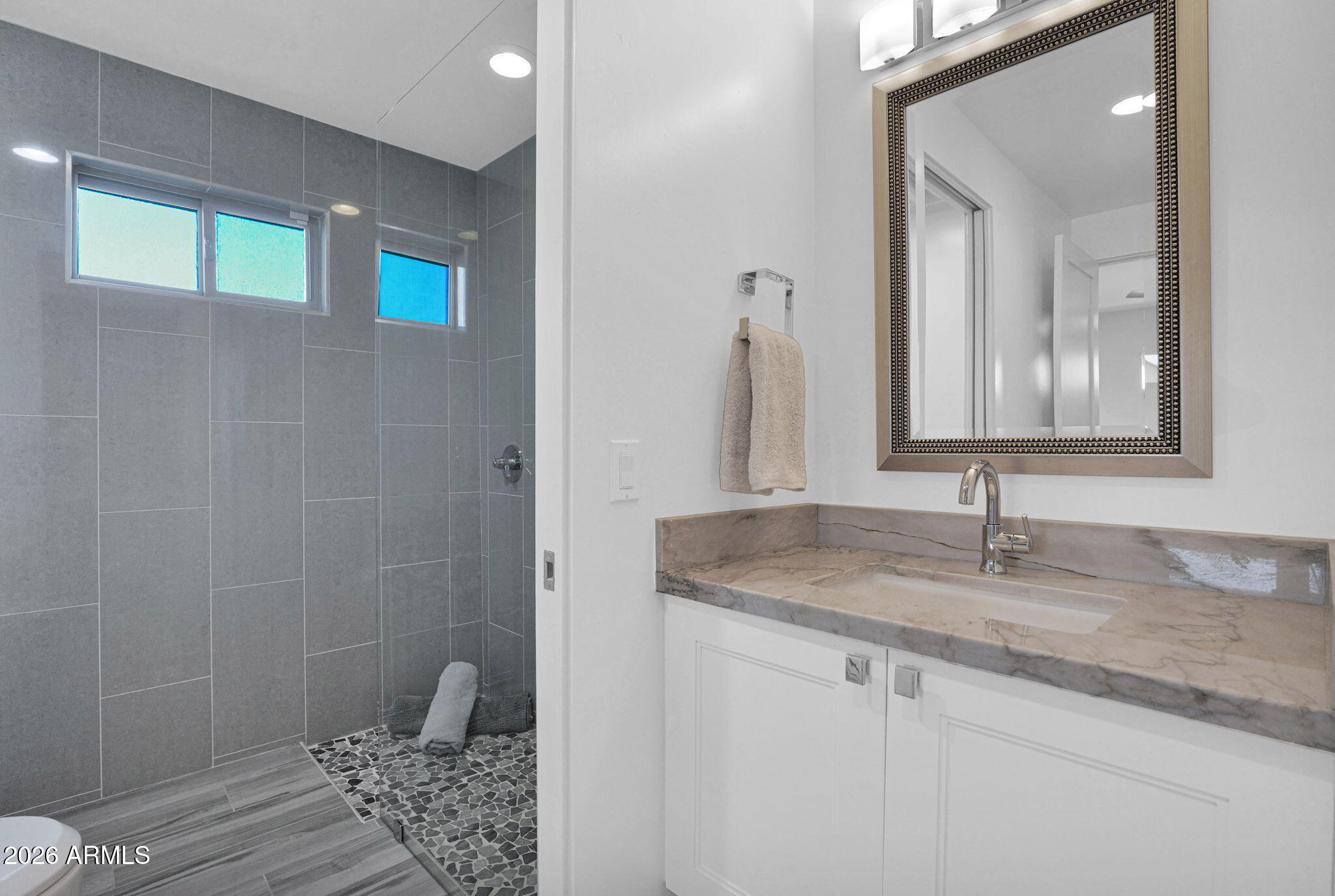 11813 North Blackheath Road Scottsdale, AZ 85254 - Photo 28 of 55 a bathroom with a granite countertop sink and a mirror