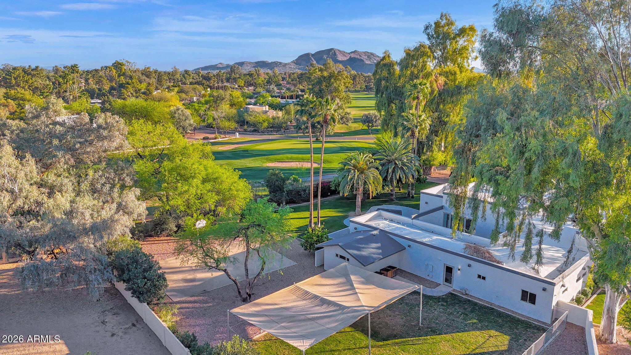 11813 North Blackheath Road Scottsdale, AZ 85254 - Photo 3 of 55 a view of swimming pool with outdoor seating and trees in the background
