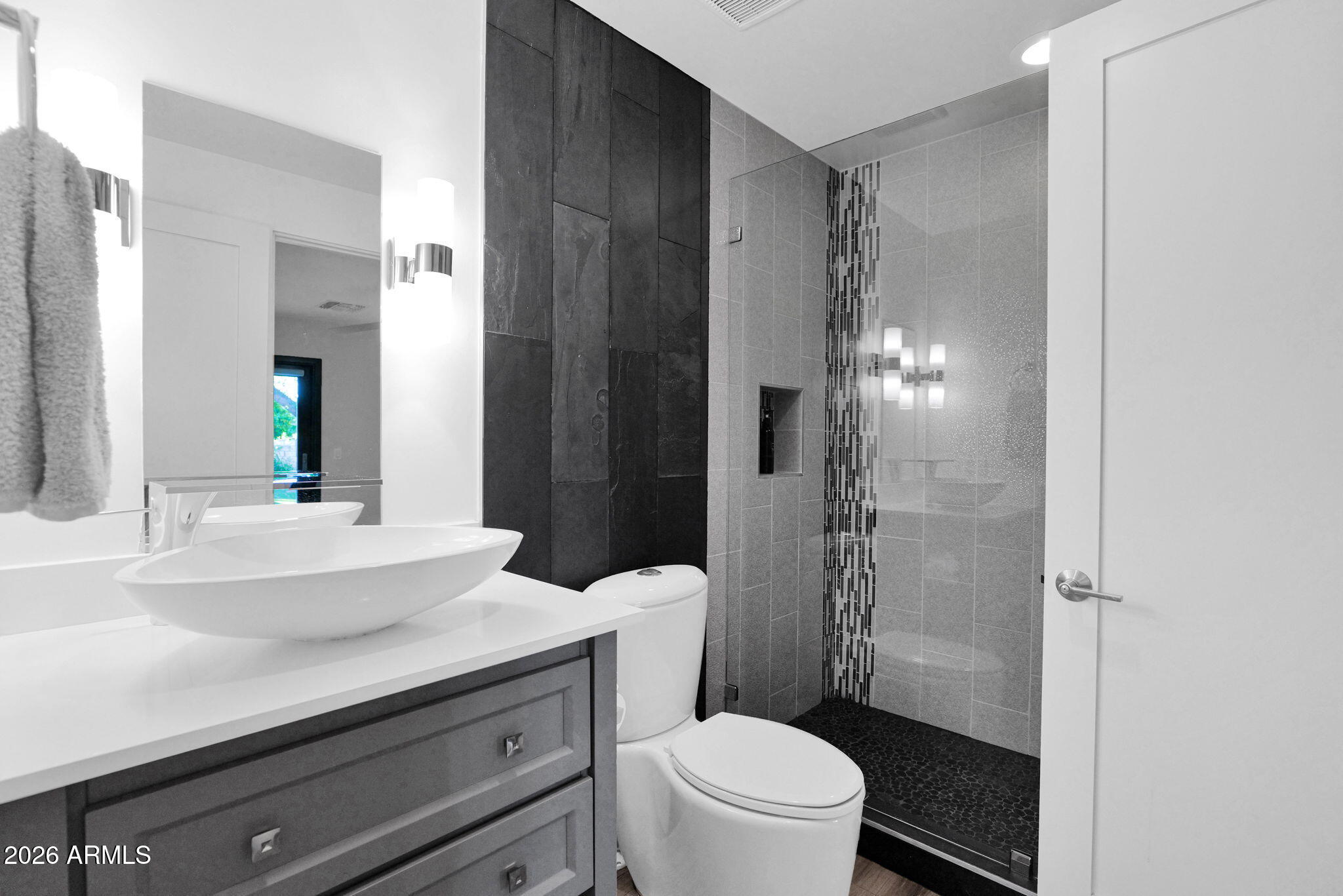 11813 North Blackheath Road Scottsdale, AZ 85254 - Photo 31 of 55 a bathroom with a sink a toilet a glass door and shower