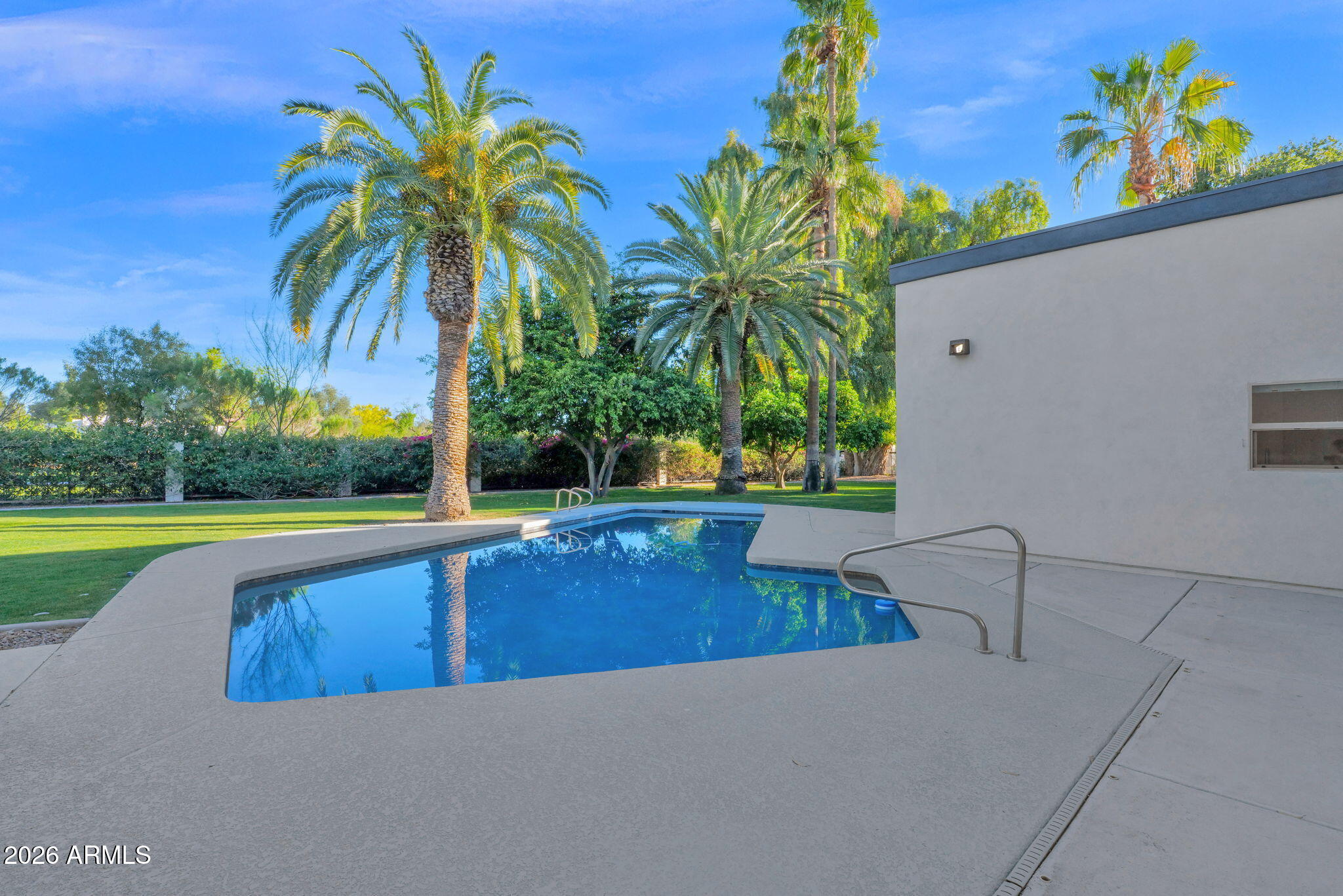 11813 North Blackheath Road Scottsdale, AZ 85254 - Photo 40 of 55 a view of a swimming pool with a yard and palm trees