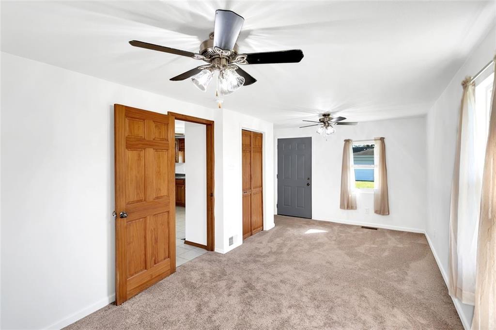 224 Trailer Boulevard Lower Burrell, PA 15068 - Photo 17 of 24 wooden floor in an empty room with a window