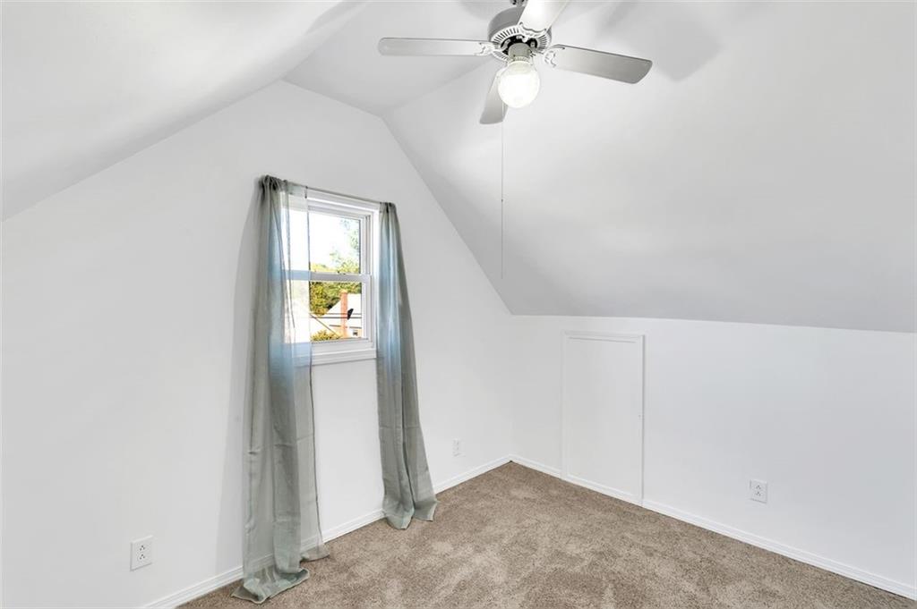 224 Trailer Boulevard Lower Burrell, PA 15068 - Photo 19 of 24 an empty room with windows and fan