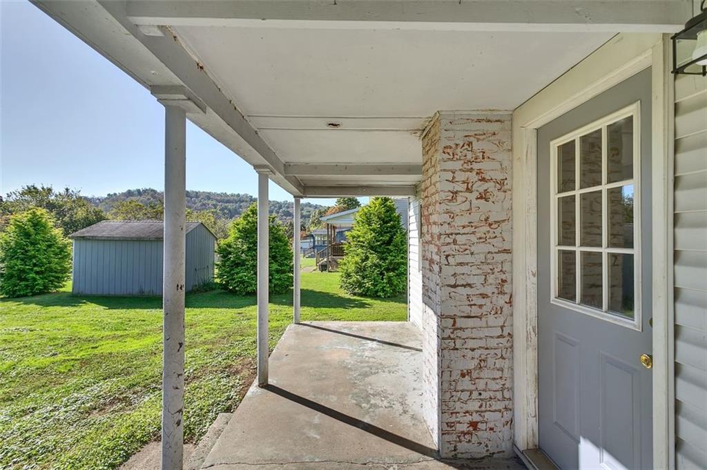 224 Trailer Boulevard Lower Burrell, PA 15068 - Photo 22 of 24 a view of a porch with furniture and garden