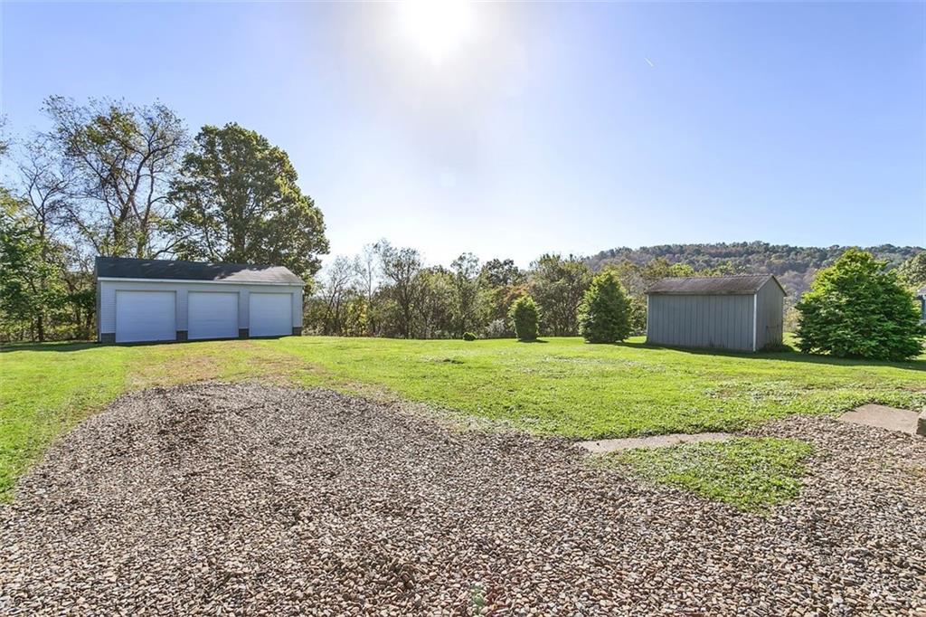 224 Trailer Boulevard Lower Burrell, PA 15068 - Photo 6 of 24 a house with green field in front of it