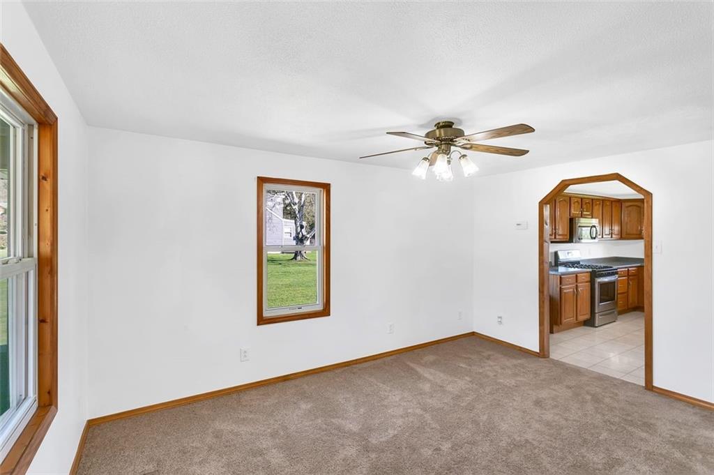 224 Trailer Boulevard Lower Burrell, PA 15068 - Photo 9 of 24 an empty room with fan and windows