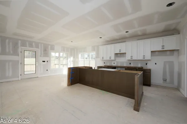 a kitchen with a stove and a refrigerator