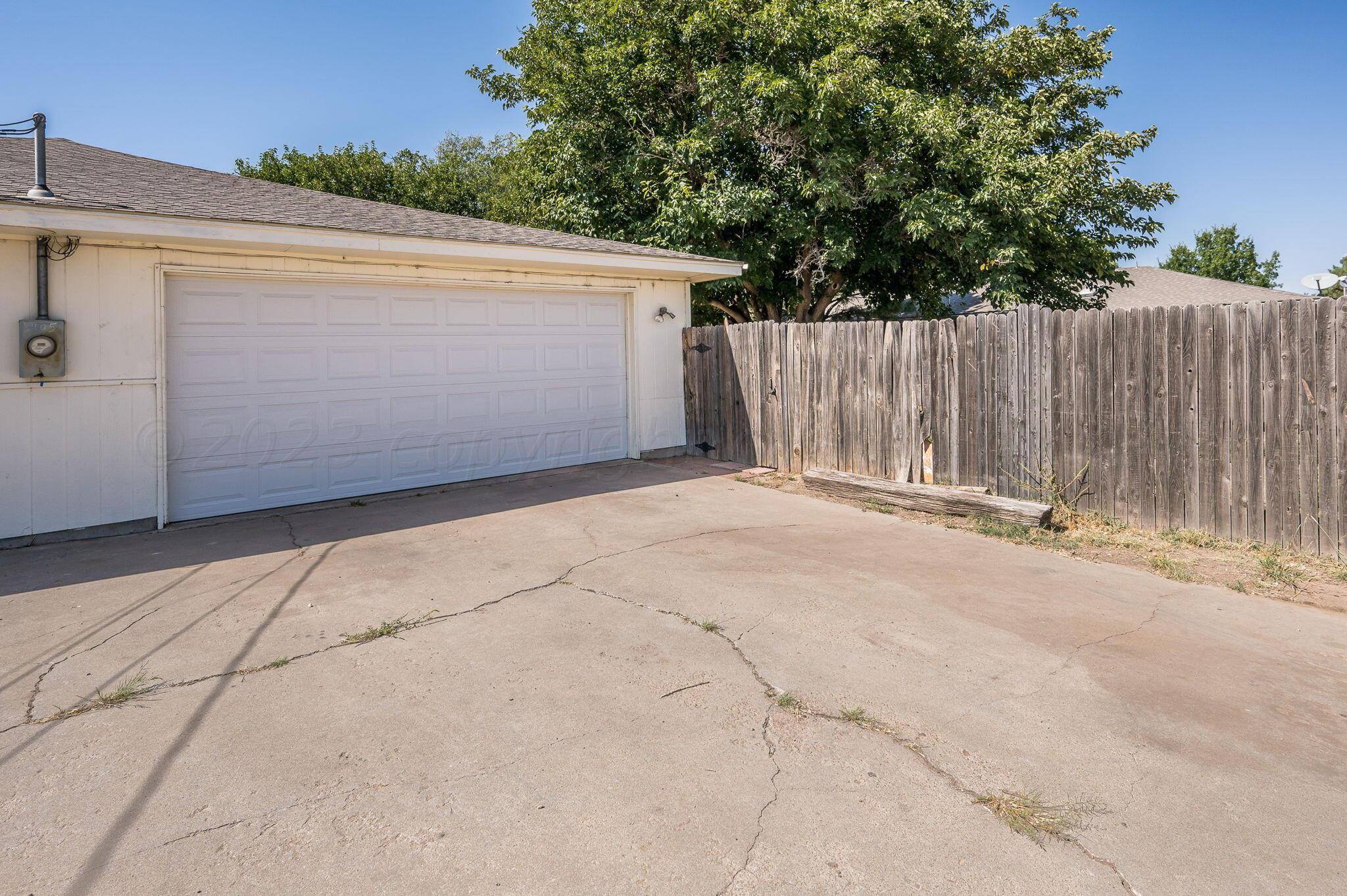 6705 Brandon Lane Amarillo, TX 79109 - Photo 18 of 20 a view of backyard and wooden fence
