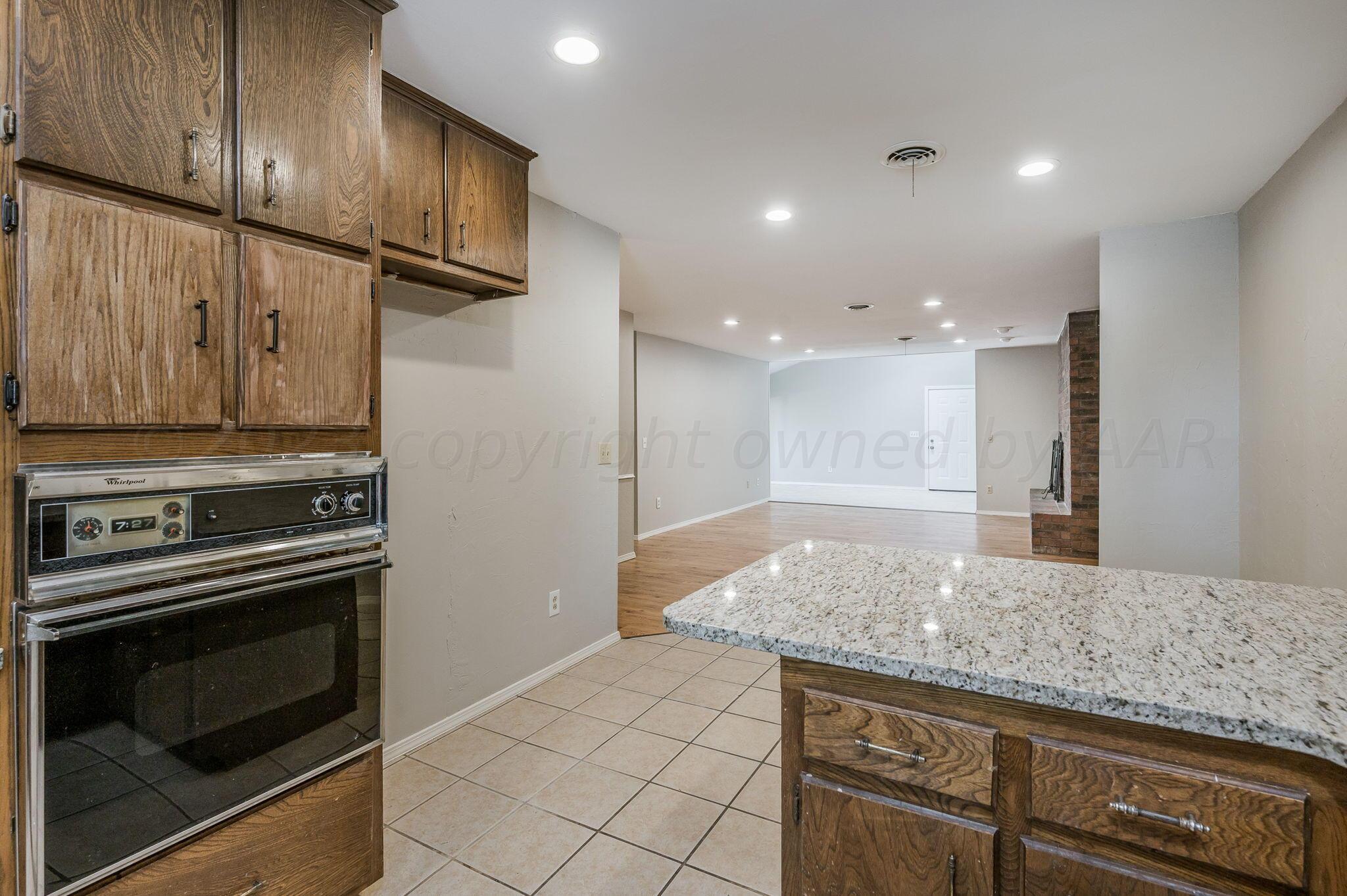 6705 Brandon Lane Amarillo, TX 79109 - Photo 8 of 20 a kitchen with stainless steel appliances granite countertop a sink and a stove