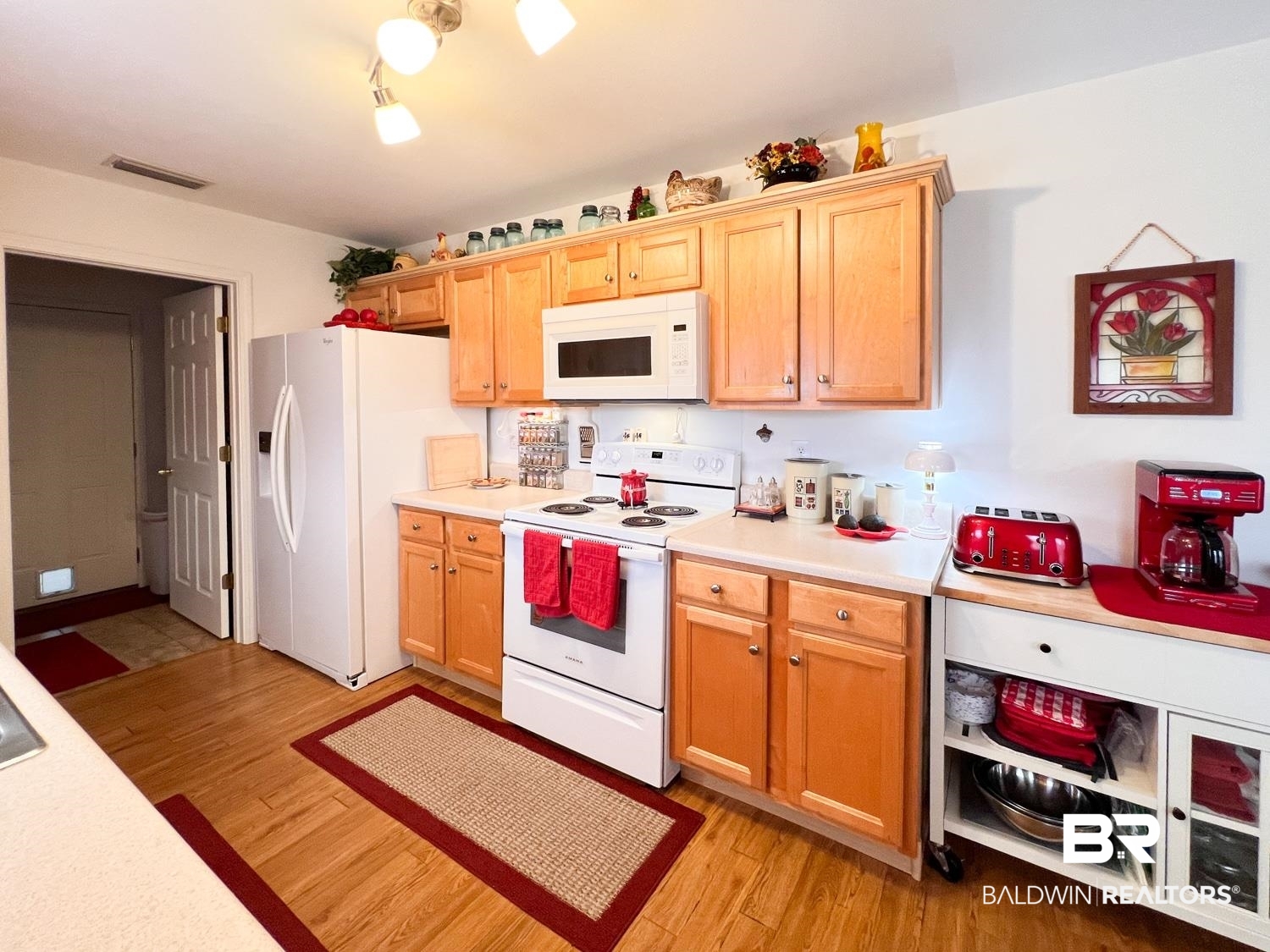 16690 Plum Court Loxley, AL 36551 - Photo 20 of 30 Kitchen with white appliances and light wood-type flooring