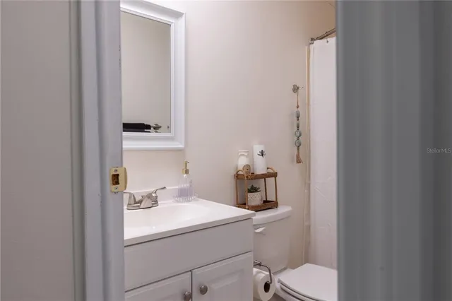 a en suite bathroom with a sink and mirror