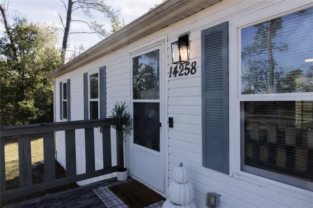 a view of a house with wooden floor and a pot
