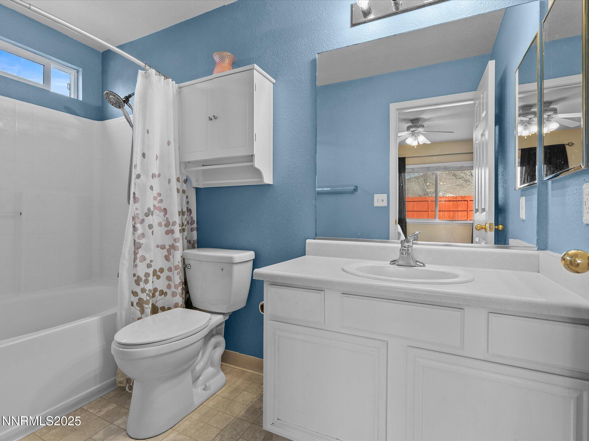 17795 Georgetown Drive Reno, NV 89508 - Photo 16 of 41 a bathroom with a sink toilet vanity and tub