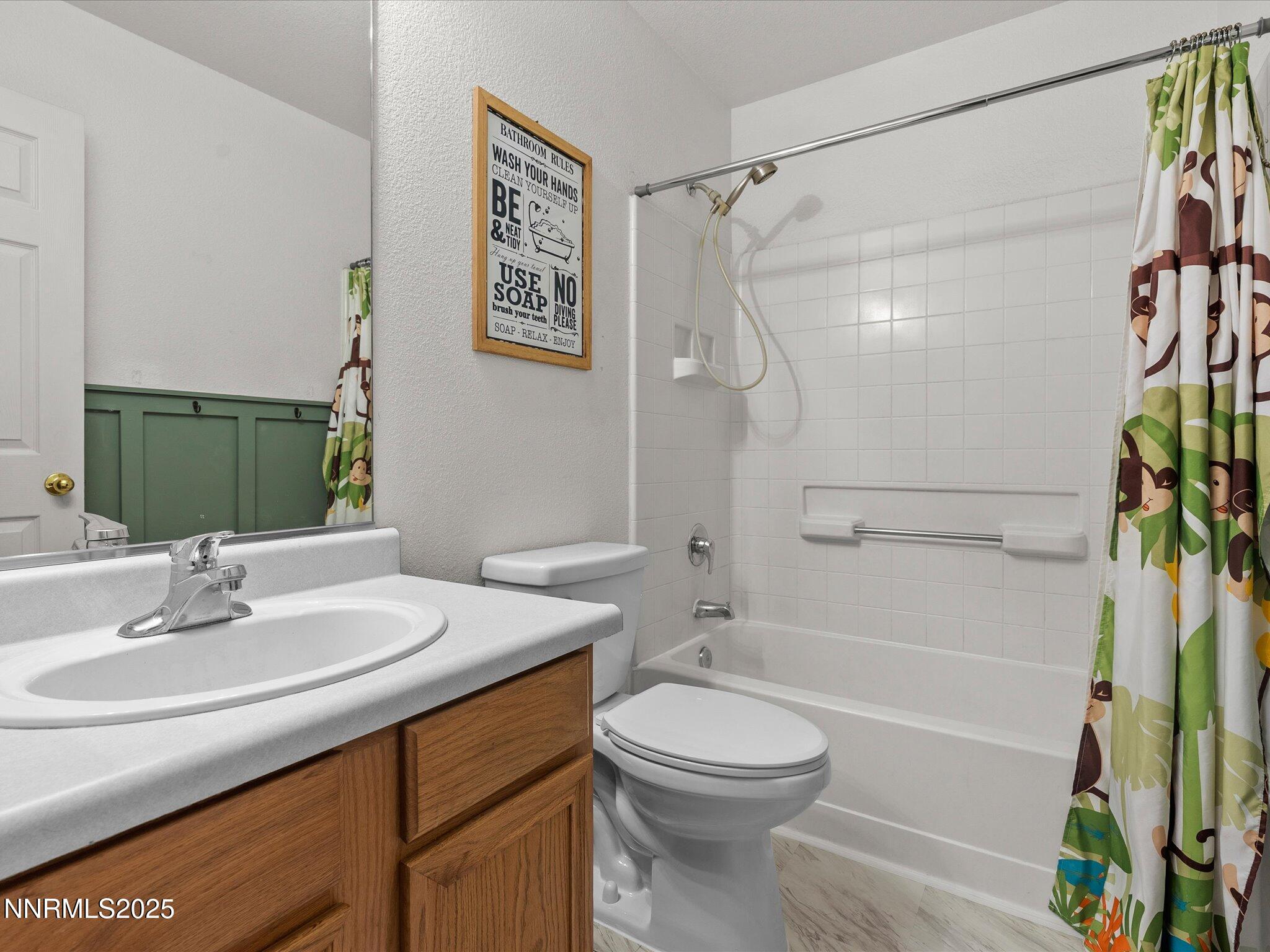 17795 Georgetown Drive Reno, NV 89508 - Photo 21 of 41 a bathroom with a sink a toilet and shower