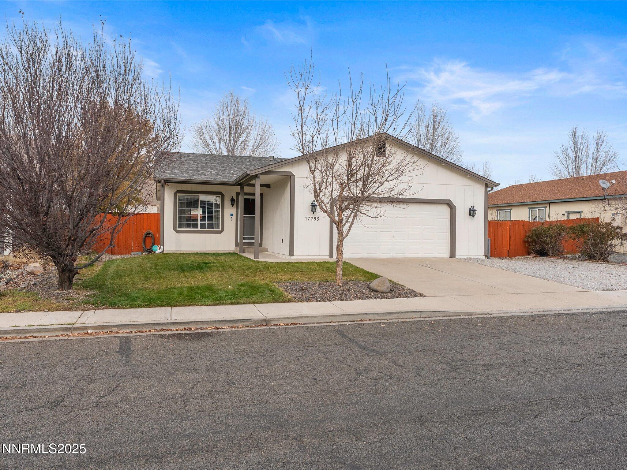 17795 Georgetown Drive Reno, NV 89508 - Photo 41 of 41 a view of a house with a yard and garage