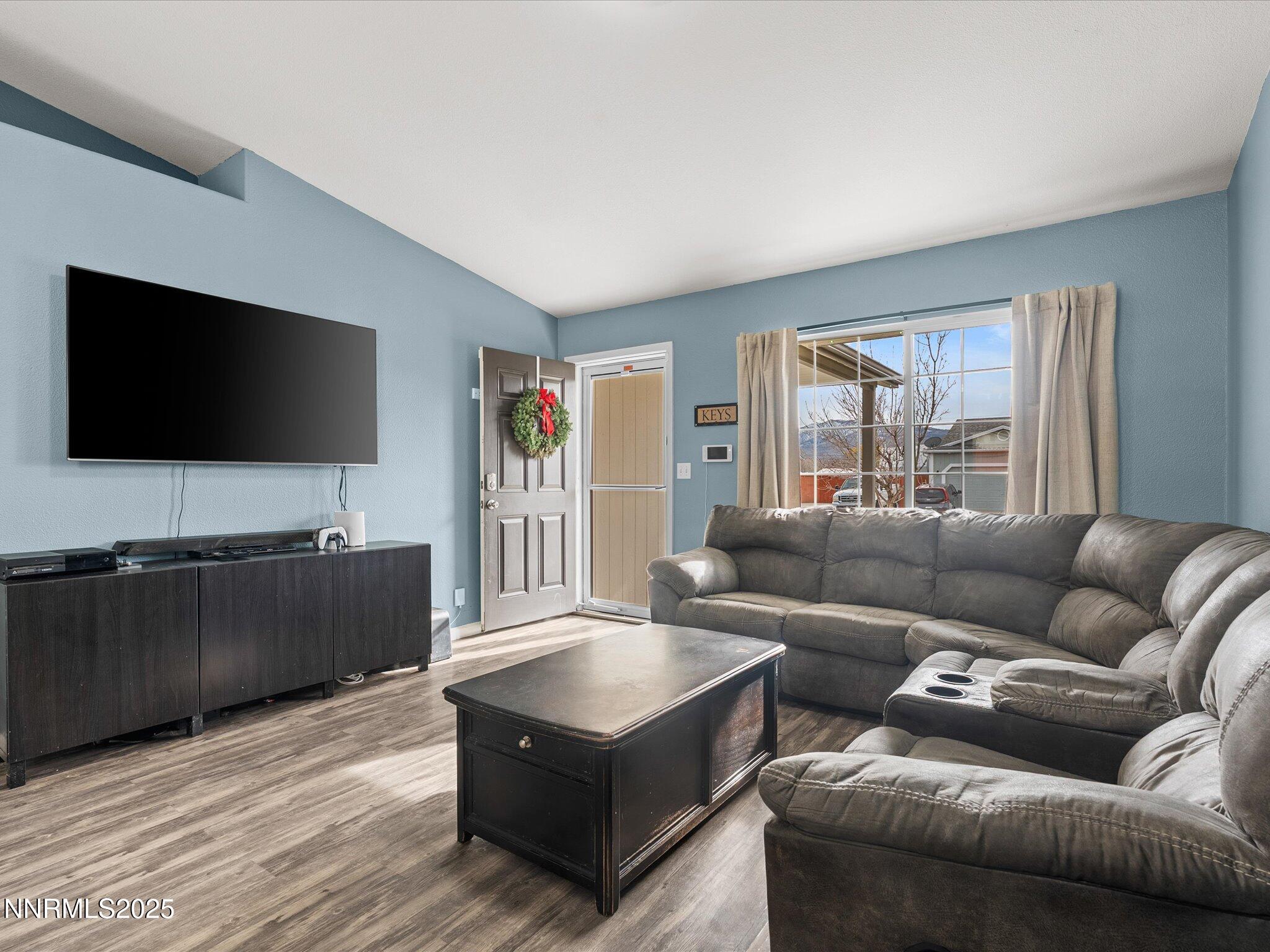17795 Georgetown Drive Reno, NV 89508 - Photo 10 of 41 a living room with furniture and a flat screen tv