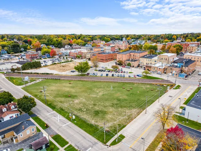 an aerial view of residential houses and outdoor space