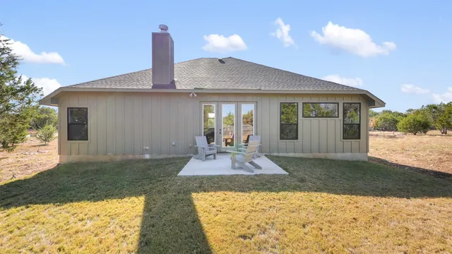 a view of a house with backyard porch and patio