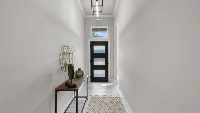 a living room with furniture a fireplace and a window