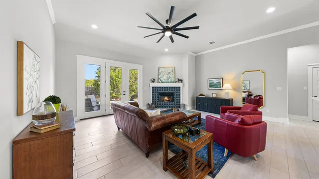 a living room with furniture fireplace and window