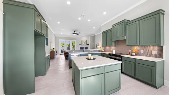 a kitchen with a sink a stove and cabinets