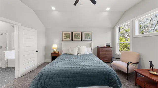 a bedroom with a bed and a couch