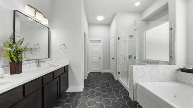 a bathroom with a tub sink and mirror