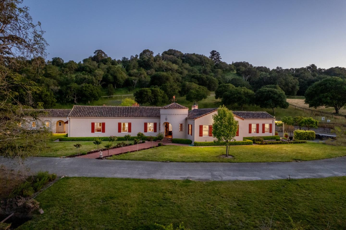 a front view of house with yard and green space