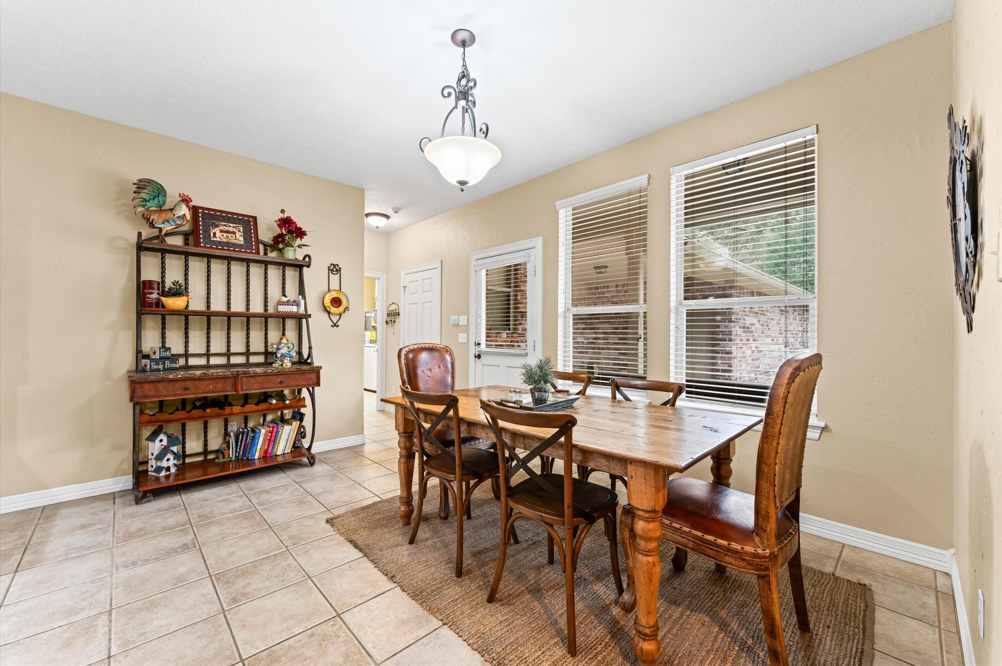 22625 Tomball Cemetery Road Tomball, TX 77377 - Photo 16 of 32 This dining area is complemented by a charming light fixture. The space is brightened by natural light from two large windows making it perfect for family gatherings.