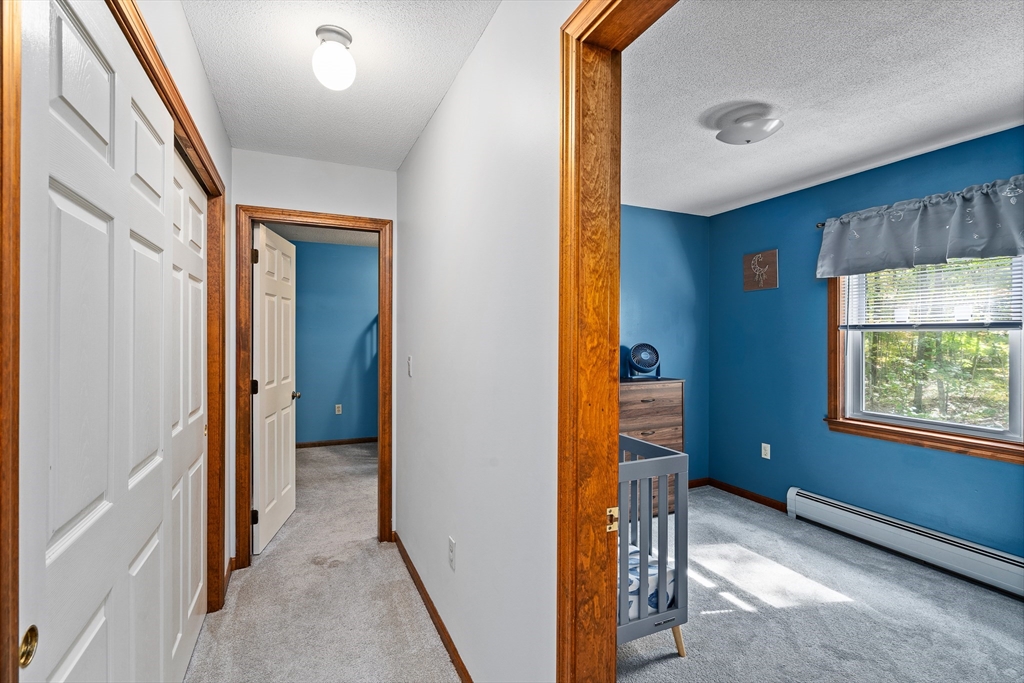 634 Burts Pit Road Northampton, MA 01062 - Photo 34 of 42 a view of a hallway with a window and a livingroom