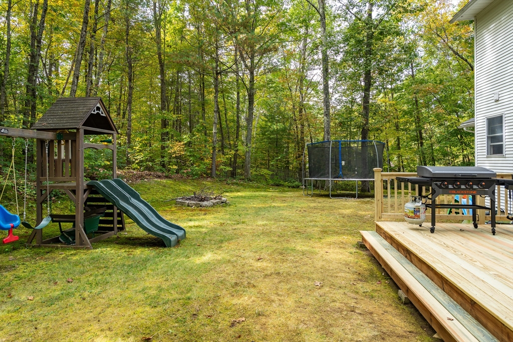 634 Burts Pit Road Northampton, MA 01062 - Photo 41 of 42 a view of a swimming pool with a bench and trees