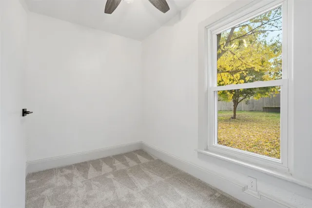 a view of an empty room and window