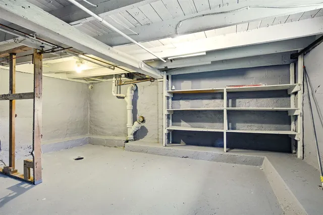 a view of room with an empty shelves