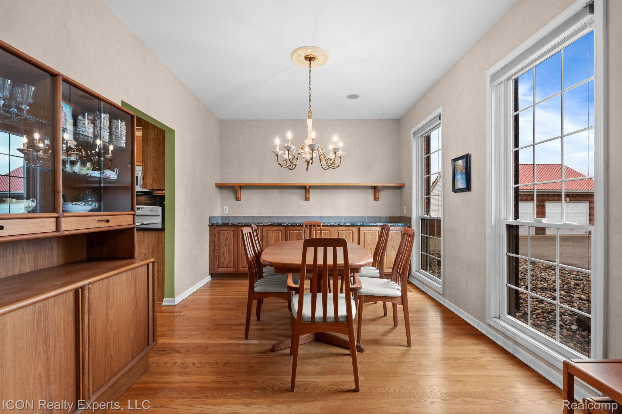 5128 Baldwin Road Metamora, MI 48455 - Photo 28 of 68 Dining area featuring light wood-style flooring and hanging lights