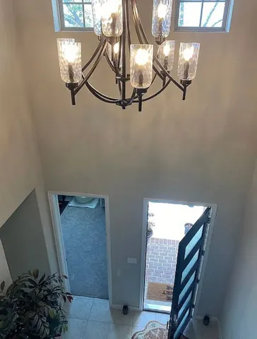 a bathroom with a double vanity sink a toilet and shower