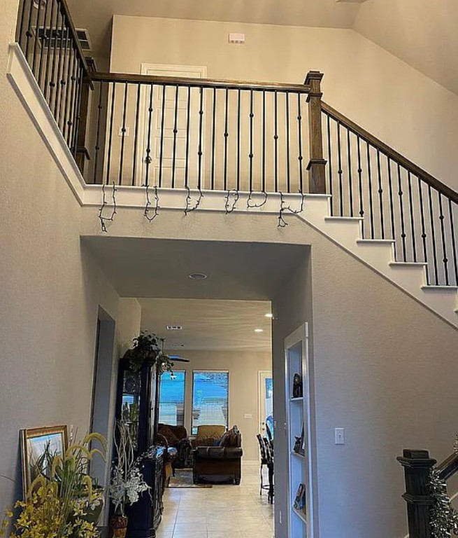 2017 Palmera Ridge Boulevard Leander, TX 78641 - Photo 16 of 17 a view of staircase with white walls and a window