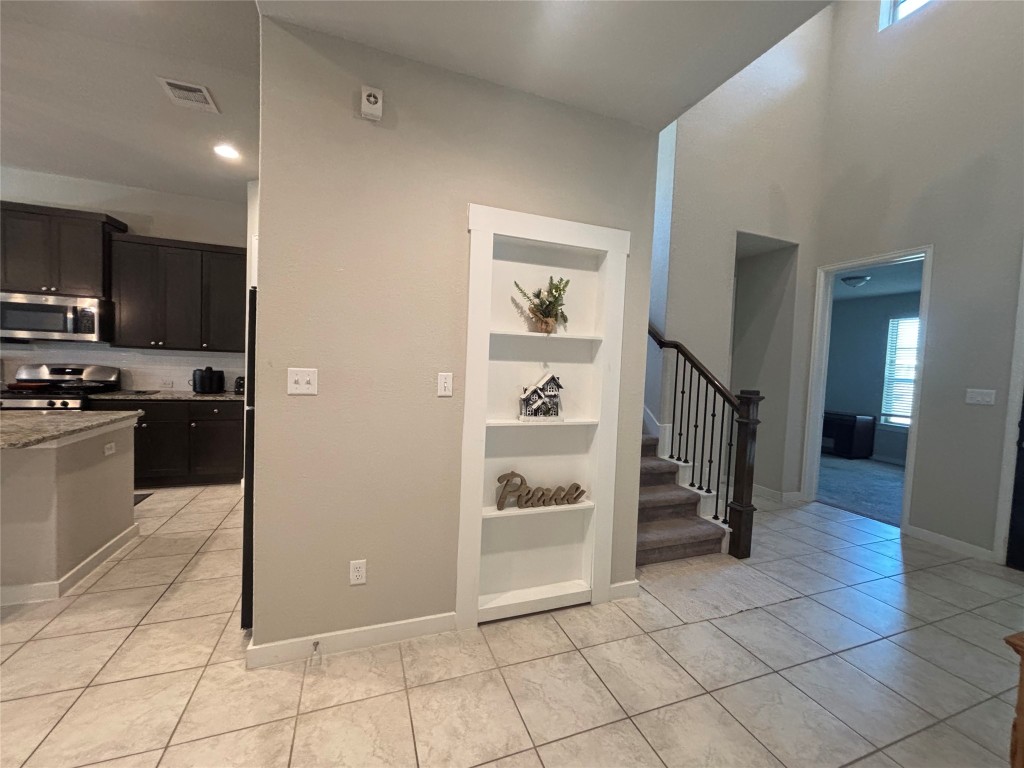 2017 Palmera Ridge Boulevard Leander, TX 78641 - Photo 3 of 17 a view of a hallway view with staircase