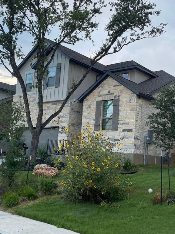 2017 Palmera Ridge Boulevard Leander, TX 78641 - Photo 7 of 17 a front view of a house with a garden