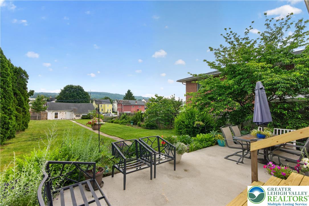 534 Ridge Street Emmaus, PA 18049 - Photo 37 of 40 a view of a patio with table and chairs potted plants with wooden fence