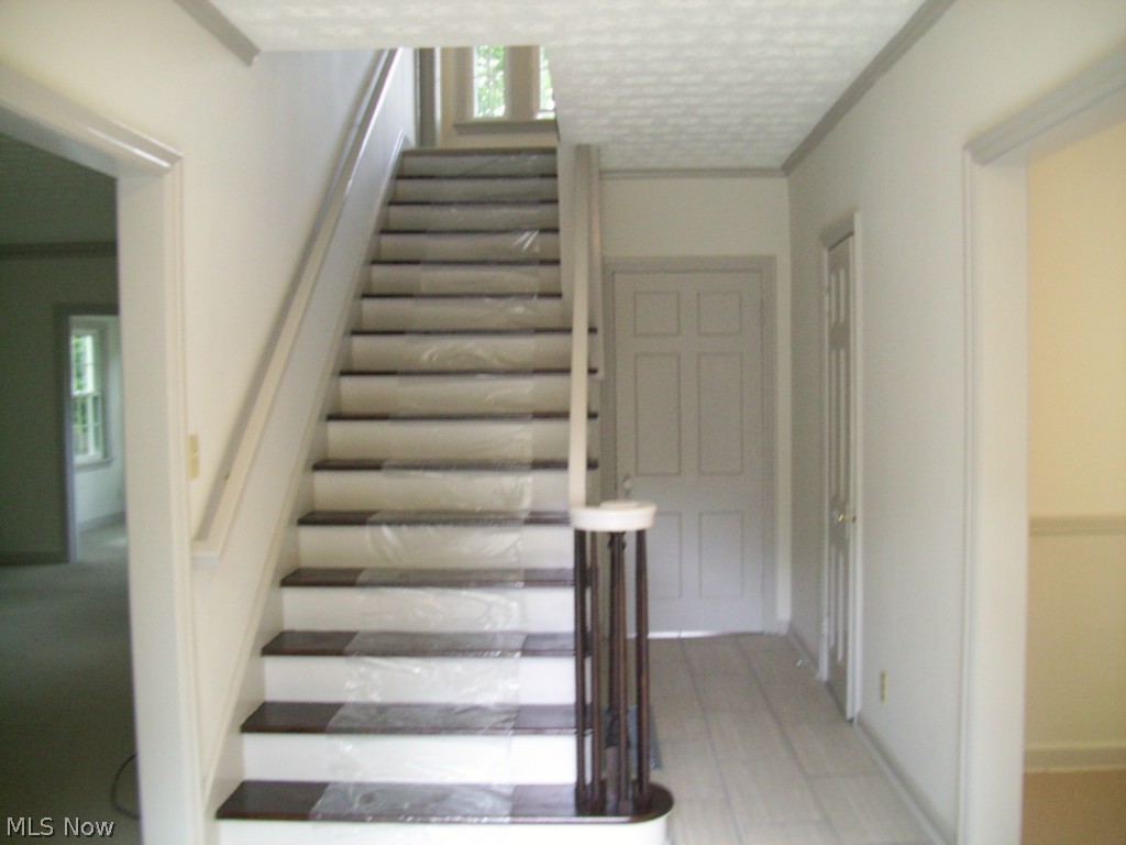 1512 Compton Road Cleveland, OH 44118 - Photo 2 of 25 Entry, Center hall staircase, hall closet, hall leading to rear entry, kitchen, and lavatory