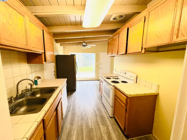 a kitchen that has a sink and a stove