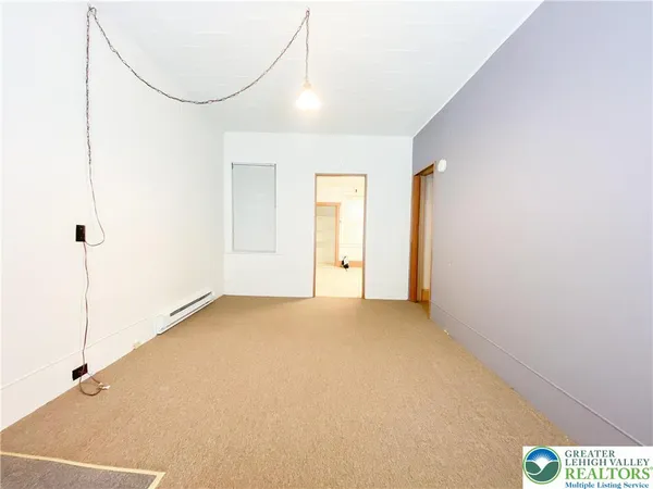a view of an empty room with a window