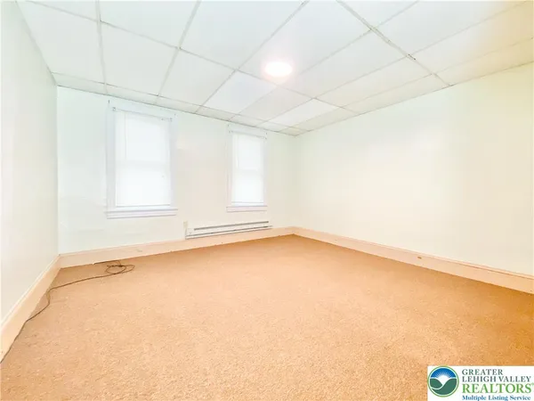 an empty room with a empty space and a window