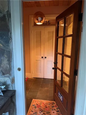 a view of a house with backyard sitting area and garden